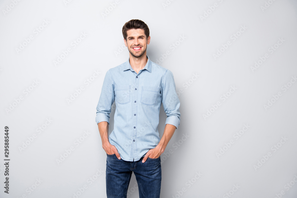 Portrait of positive cheerful dreamy emotions man have fun free time with his colleagues after work put hands pockets wear casual style clothing isolated over grey color background - obrazy, fototapety, plakaty 