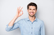 © deagreez - Portrait of confident cool smart entrepreneur promoter freelancer advertise sales show ok signs select suggest perfect offer option wear casual style clothe isolated over grey color background