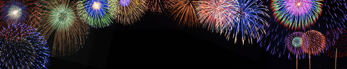 Wall Mural - A panoramic background of fireworks.