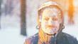 © raisondtre - Fun portrait of an young frozen man. Jogging in a blizzard in the woods. Face covered with snow and frost. Closeup portrait of happy young guy smiles in cold weather in the winter forest at sunset.