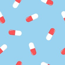 Seamless Pattern Texture Of Red Oval White And Red Medical Pharmaceutical Pills Capsules With Medicine, Drugs, Vitamins On A Blue Background.