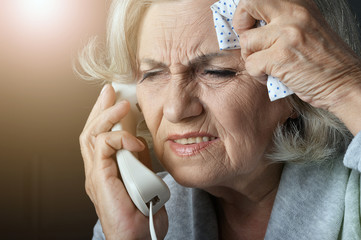 Wall Mural - Close up portrait of upset senior woman