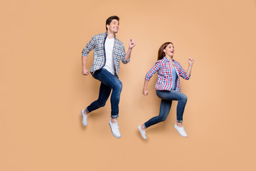 Sticker - Full length photo of two people lady guy jumping high rushing discount shopping tourists traveling best emotions wear casual clothes isolated beige background