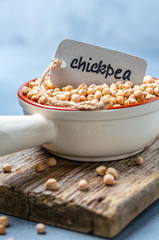 Wall Mural - Organic chickpeas in a ceramic bowl.