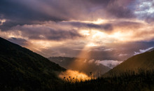 Fairy Landscape With Dramatic Sky And Sunbeam In Mountains
