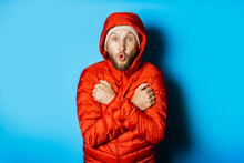 Frozen Man In A Hat And A Red Jacket On A Blue Background