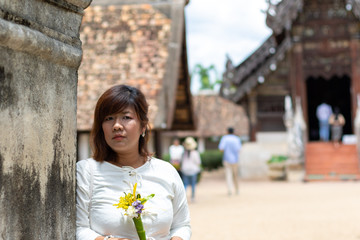 Asian women happiness on holidays in North of Thailand to learning with dressing style and culture native. Asia vacation time.