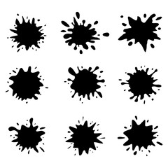 Black ink blots set on white background