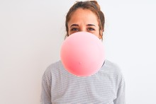 Young Redhead Woman Chewing Gum And Blowing Hair Bubble Over White Isolated Background With A Happy Face Standing And Smiling With A Confident Smile Showing Teeth
