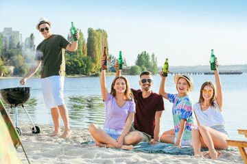 Canvas Print - Friends at barbecue party near river