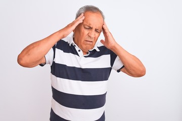 Sticker - Senior grey-haired man wearing casual striped polo standing over isolated white background with hand on head for pain in head because stress. Suffering migraine.