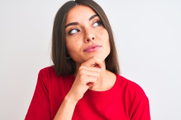 Poster - Young beautiful woman wearing red casual t-shirt standing over isolated white background serious face thinking about question, very confused idea