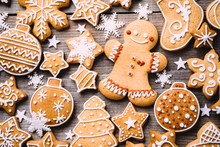 Festive Food, Kitchen Background, Texture With Homemade Gingerbread Cookies On Wooden Table. Christmas And New Year Celebration Traditions