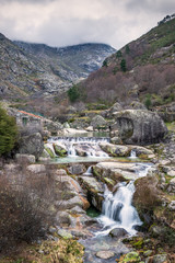 Canvas Print - View of the river beach of Loriga in Serra da Estrela, Portugal, with its waterfalls and the throat of Loriga in the background.