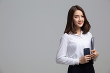 Business Woman Holding Laptop And Phone