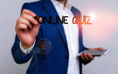 Conceptual hand writing showing Online Quiz. Concept meaning game or a mind sport that are published on the Internet Businessman blue suite and white shirt pointing with finger