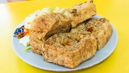 snack of stinky tofu on the table