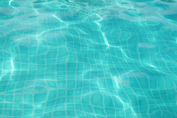 Background of rippled pattern of clean water in swimming pool 