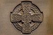 Wonderful embossed Celtic stone cross, full of details and textures in its elaborate carvings.