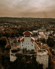 Wall Mural - Aerial vertical shot of the Gradacac Castle under a cloudy sky in Bosnia, Herzegovina