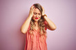 © Krakenimages.com - Young beautiful woman wearing t-shirt standing over pink isolated background suffering from headache desperate and stressed because pain and migraine. Hands on head.