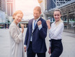 © potsawat - business people achieving goals,happy business team celebrating victory in city