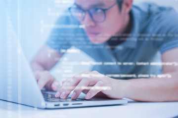 close up computer programmer man hand typing configuration on keyboard at laptop for input coding language to software for fix bug and defect of system in data center room , engineering and technology
