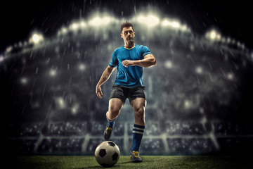 Soccer player in action on a dark background