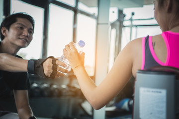 fitness woman doing exercises and warm up at gym ; healthy lifestyle