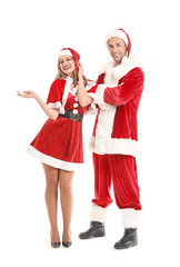 Poster - Young couple dressed as Santa Claus on white background