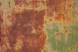 Rusty metal wall, old sheet of iron covered with rust and corrosion paint. Oxidized iron panel. Texture or background.