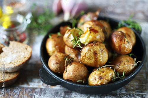 Baked potatoes in a peel in a cast-iron skillet. Rustic potatoes. Selective  focus. Macro. - Buy this stock photo and explore similar images at Adobe  Stock | Adobe Stock