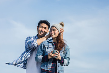 Wall Mural - Asian couple enjoying nature view outdoor, lifestyle concept.