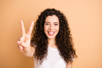 Hello wonderful world. Closeup photo of amazing lady showing v-sign symbol positive mood wear white casual outfit isolated beige pastel color background