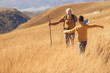 © Mediteraneo - Senior man with grandson on country walk in autumn.