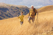 © Mediteraneo - Senior man with grandson on country walk in autumn.