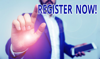 Conceptual hand writing showing Register Now. Concept meaning official list or record showing or things into web or forum Businessman pointing with pen in empty copy space