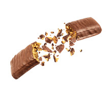 Chocolate Bar With Nougat Is Torn In The Air On White Background