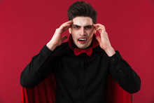 Image Of Vampire Man With Blood And Fangs In Black Halloween Costume