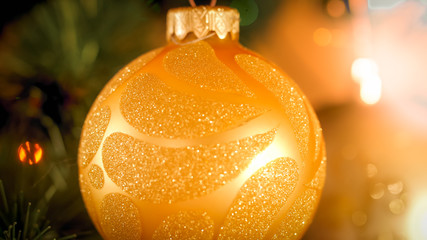 Wall Mural - Macro image of golden glitters on Christmas bauble