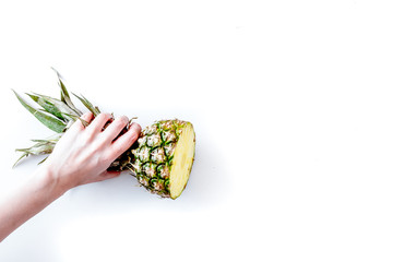 summer dessert with pineapples in hand on white background top view mock up