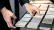 © zephyr_p - Male architect or interior designer hand choosing ceramic texture sample from swatch board in design studio. Floor and wall finishing material for architecture and construction industry.