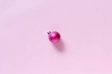Pink Christmas Bauble On A Light Pink Background