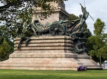 Porto, Portugal. Unrecognizable People Working On Monumento Aos Heróis Da Guerra Peninsular, The Monument Erected In 190 -1951 On The Square Rotunda Da Boavista