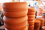 Fototapeta Kwiaty - Handmade ceramic crockery made of clay of brown terracotta color