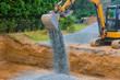 Industrial construction of foundation excavator moving gravel for building