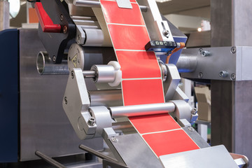 Poster - Fragment of the conveyor of the pharmaceutical labeling machine. Abstract industrial background.