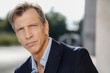 © DanieleCruciani.it - 40-50 years old business man in a blue suit posing outdoor