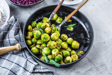 Frying Pan With Roasted Brussel Sprouts On Table