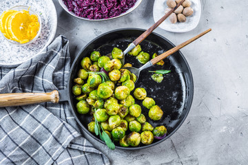 Wall Mural - Frying pan with roasted brussel sprouts on table